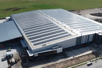 A large building with solar panels on rooftop